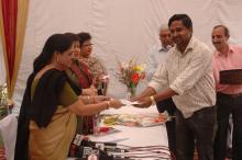 Shri Vibhash Tripathi receiving the 1st prize for Essay Competition by Dr. Girija Vyas, hon'bl Chairperson, NCW